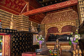 Wat Xieng Thong temple in Luang Prabang, Laos.  La Chapelle Rouge , the Red Chapel. The reclining Buddha bronze sculpture that dates from the construction of the temple. 